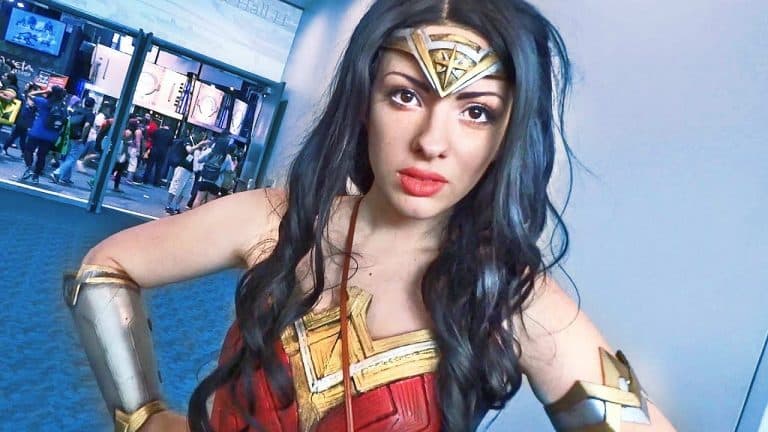 A woman in wonder woman costume posing for a photo.