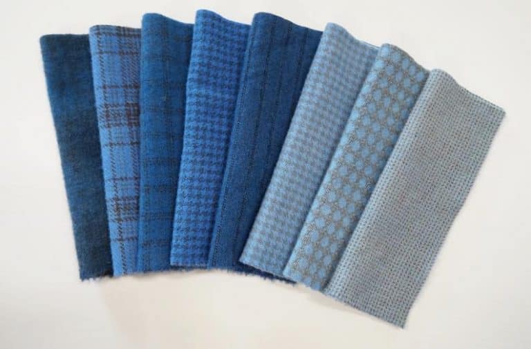 A collection of blue and gray plaid fabric.