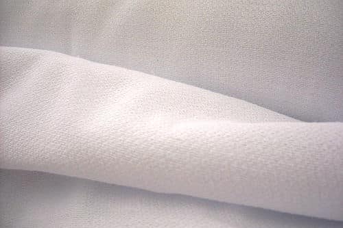 A close up of a white fabric.