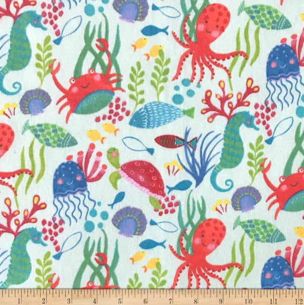 A colorful fabric with octopus, fish, and octopus.