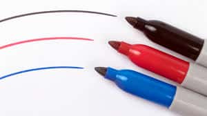 A set of colored markers on a white background.