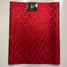 A red cloth with a pattern on it.