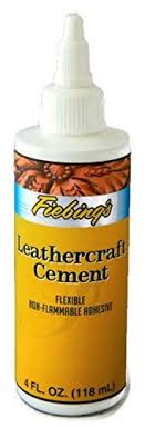 A bottle of leathercraft cement on a white background.