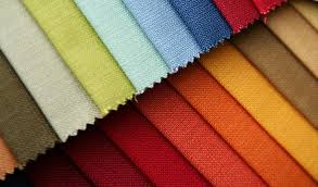 A close up of different colors of fabric.