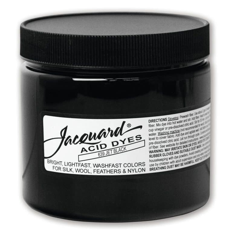 A jar of vibrant black clothing dye on a white background.